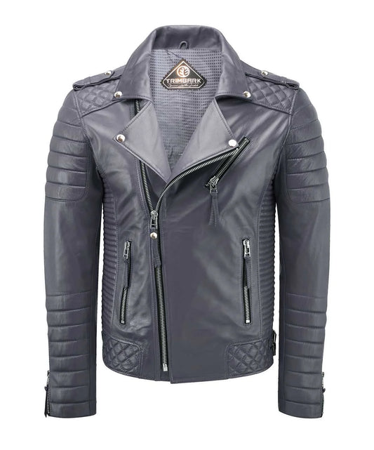 The Men’s Genuine Leather Biker Jacket Gray, crafted from lambskin, features quilted shoulders and sleeves, silver zippers, a diagonal front zip closure, snap buttons on the collar, and a branded neck patch.